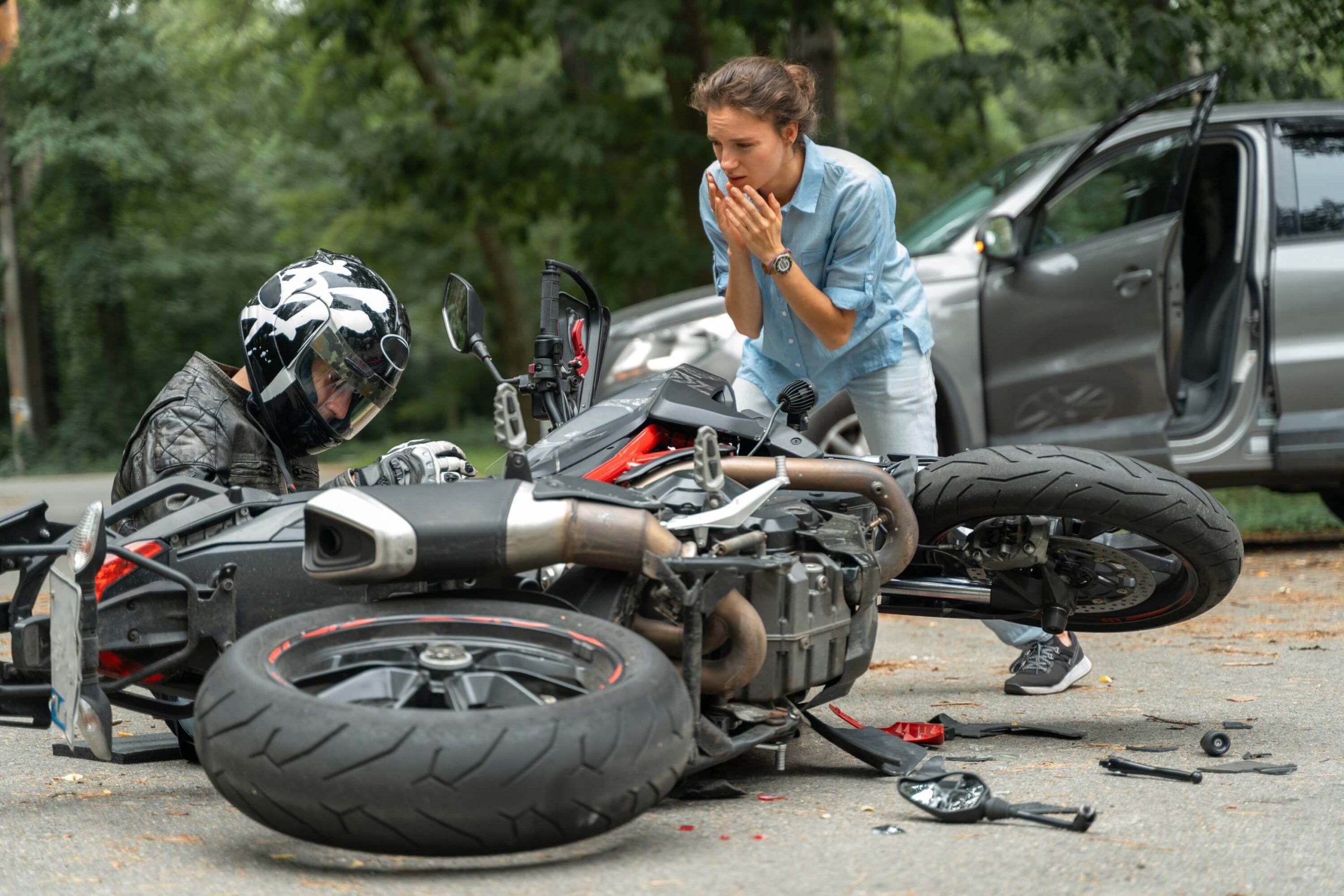 Motorcycle accident and woman looking
