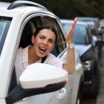 Angry driver yelling at someone in a traffic jam